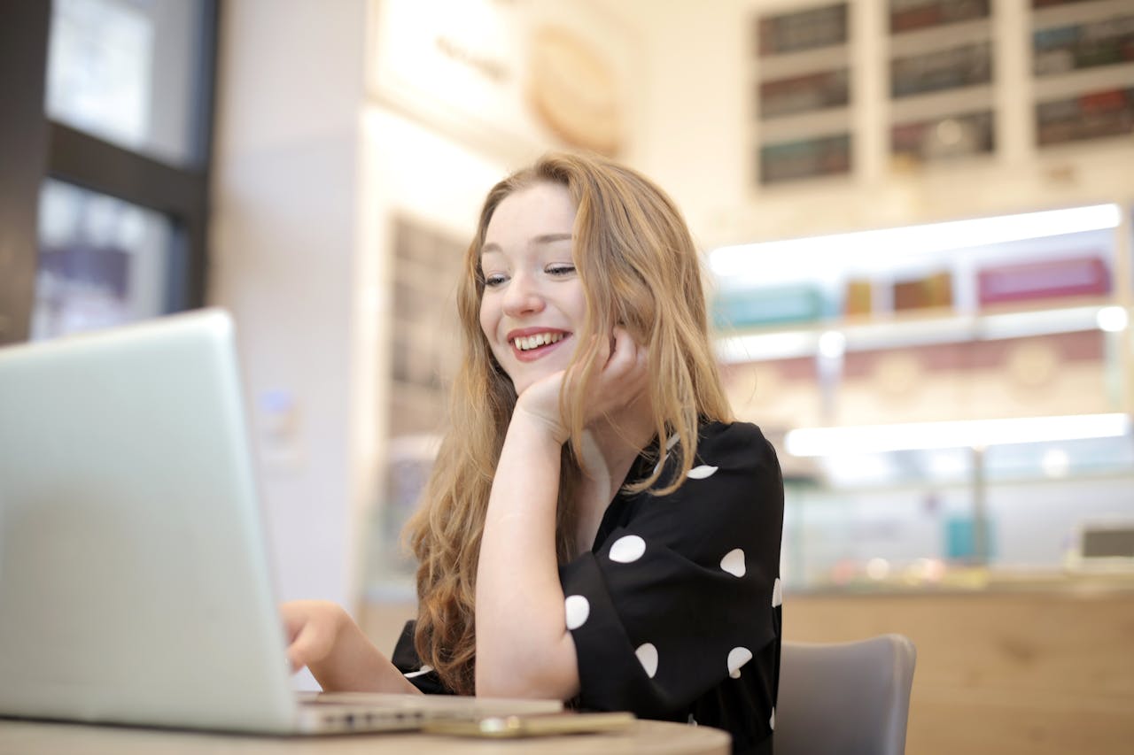 Woman at home using laptop for online therapy