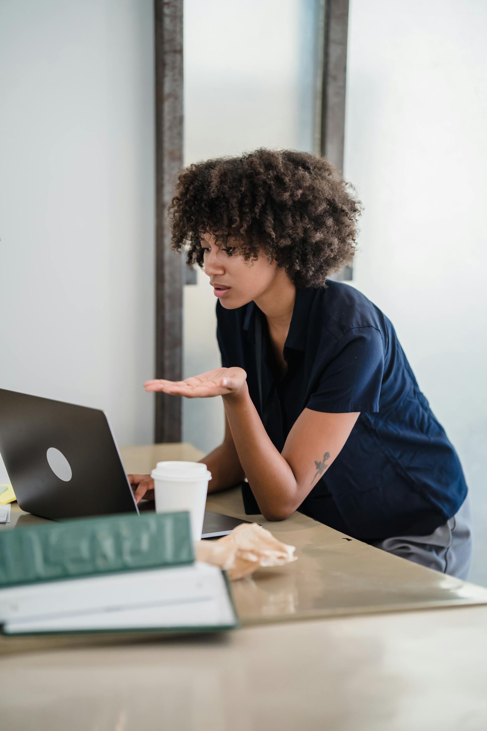 Focused woman participates in a remote video call conducting an adult ADHD assessment online