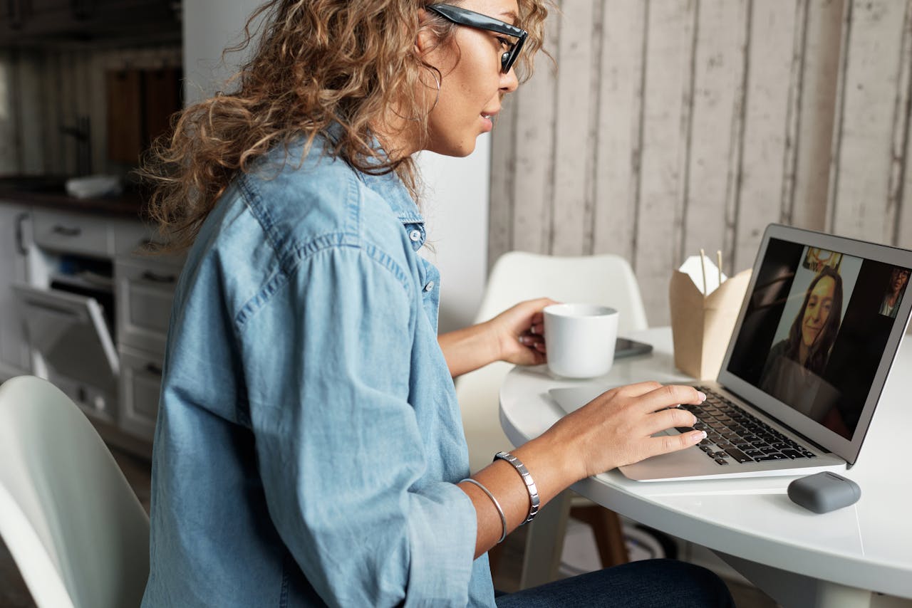 Woman having an online therapy session at home.